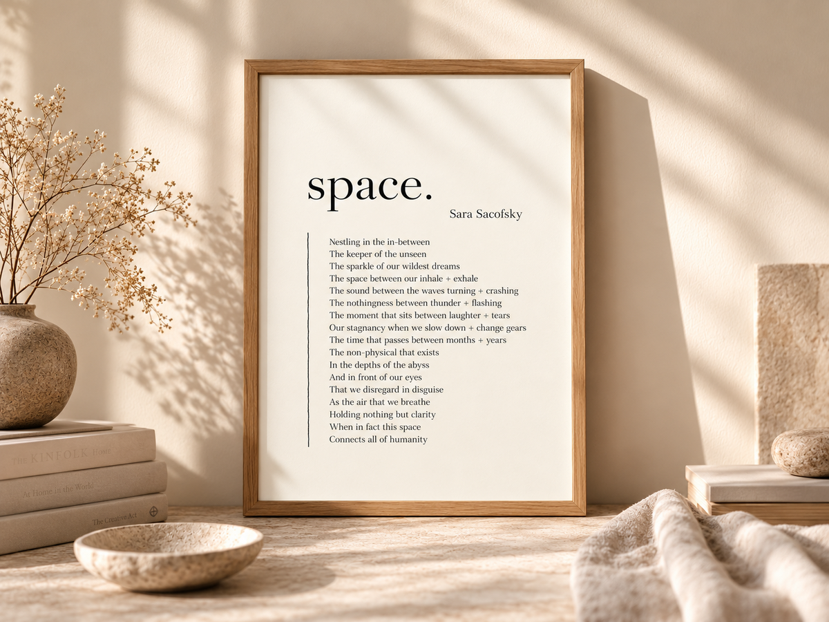 The original space. poetry print by Sara Sacofsky displayed in a natural oak frame, with warm sunlight, dried flowers, books, linen and ceramics.